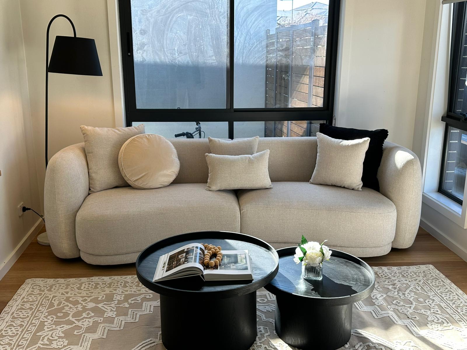 Styled lounge room with warm neutral furniture